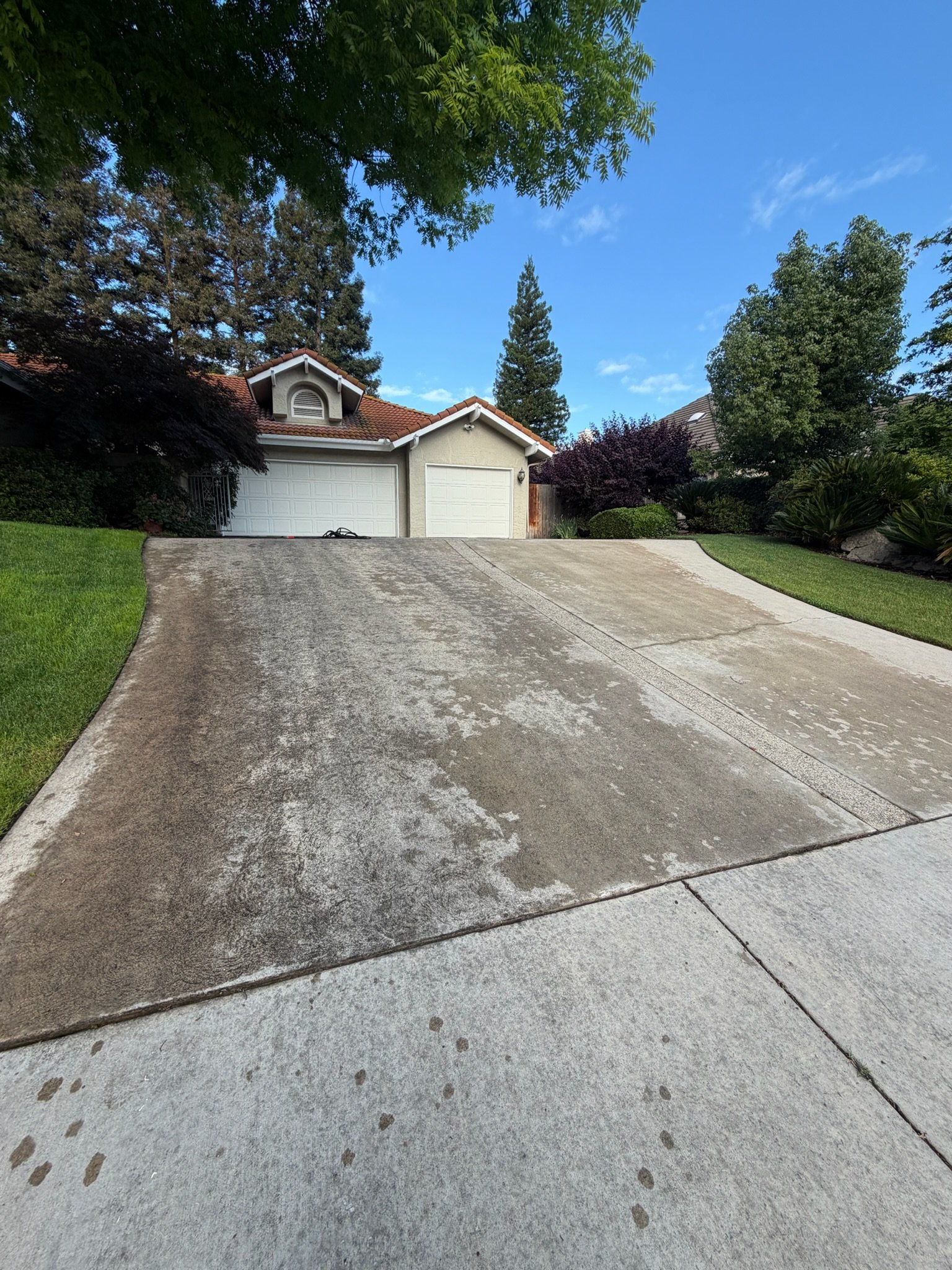 Stained, dirty driveway before pressure washing