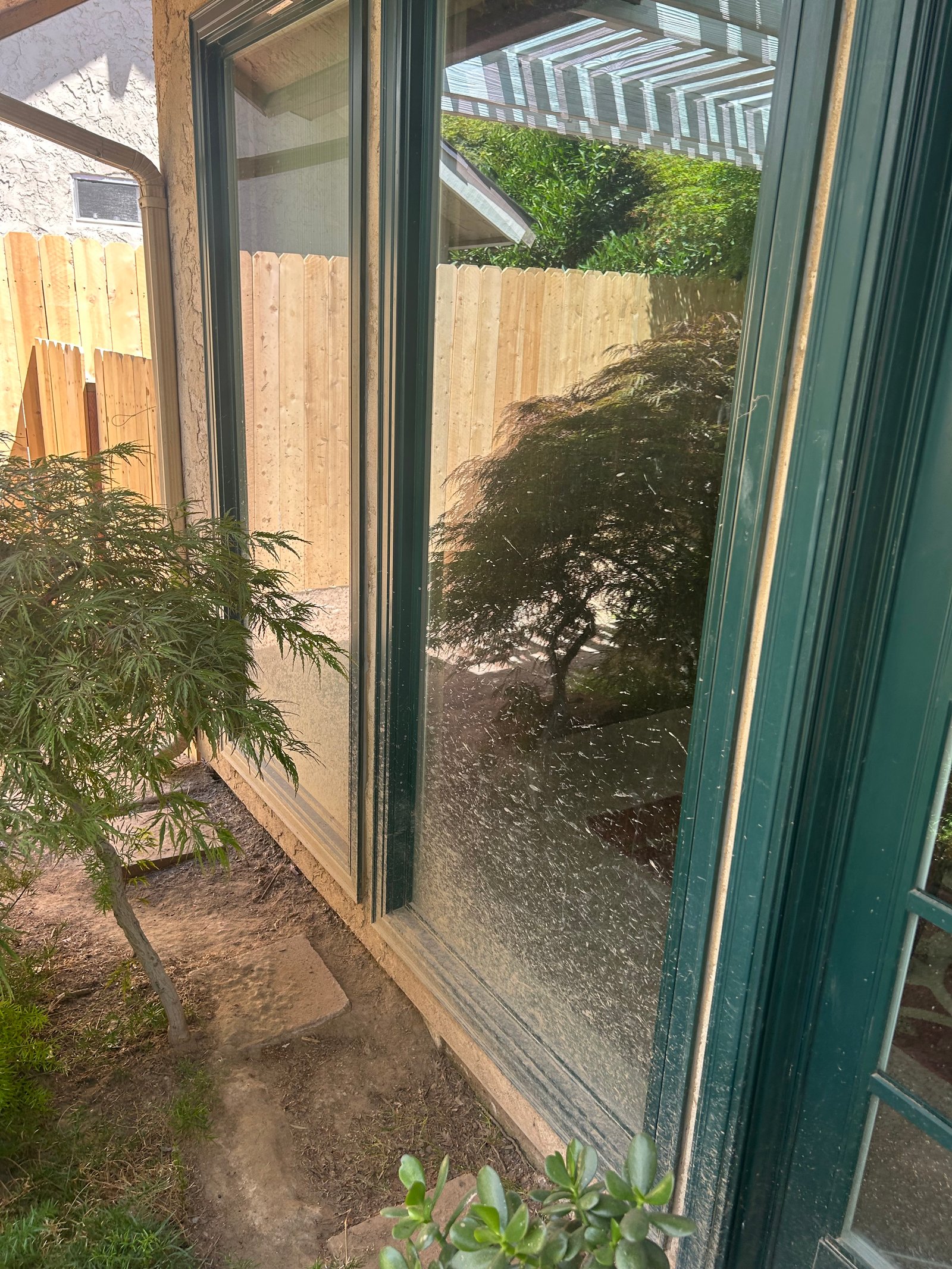 Dirty, spotted window before cleaning